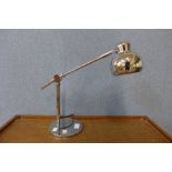 A chrome desk lamp