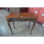 A George I mahogany fold over card table