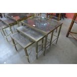 An Italian brass and glass topped nest of tables