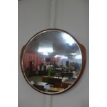 A teak framed circular mirror