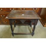 A Victorian carved oak occasional table