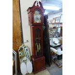 A triple weight Westminster chime long cased clock