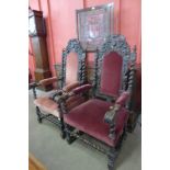 A pair of Victorian Jacobean Revival carved oak and fabric upholstered throne chairs