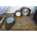 A Smiths oak mantel clock, an oak aneroid barometer and another small timepiece