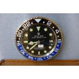 A Rolex style dealer's wall clock