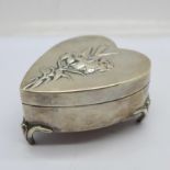 A heart shaped silver trinket box by William Comyns