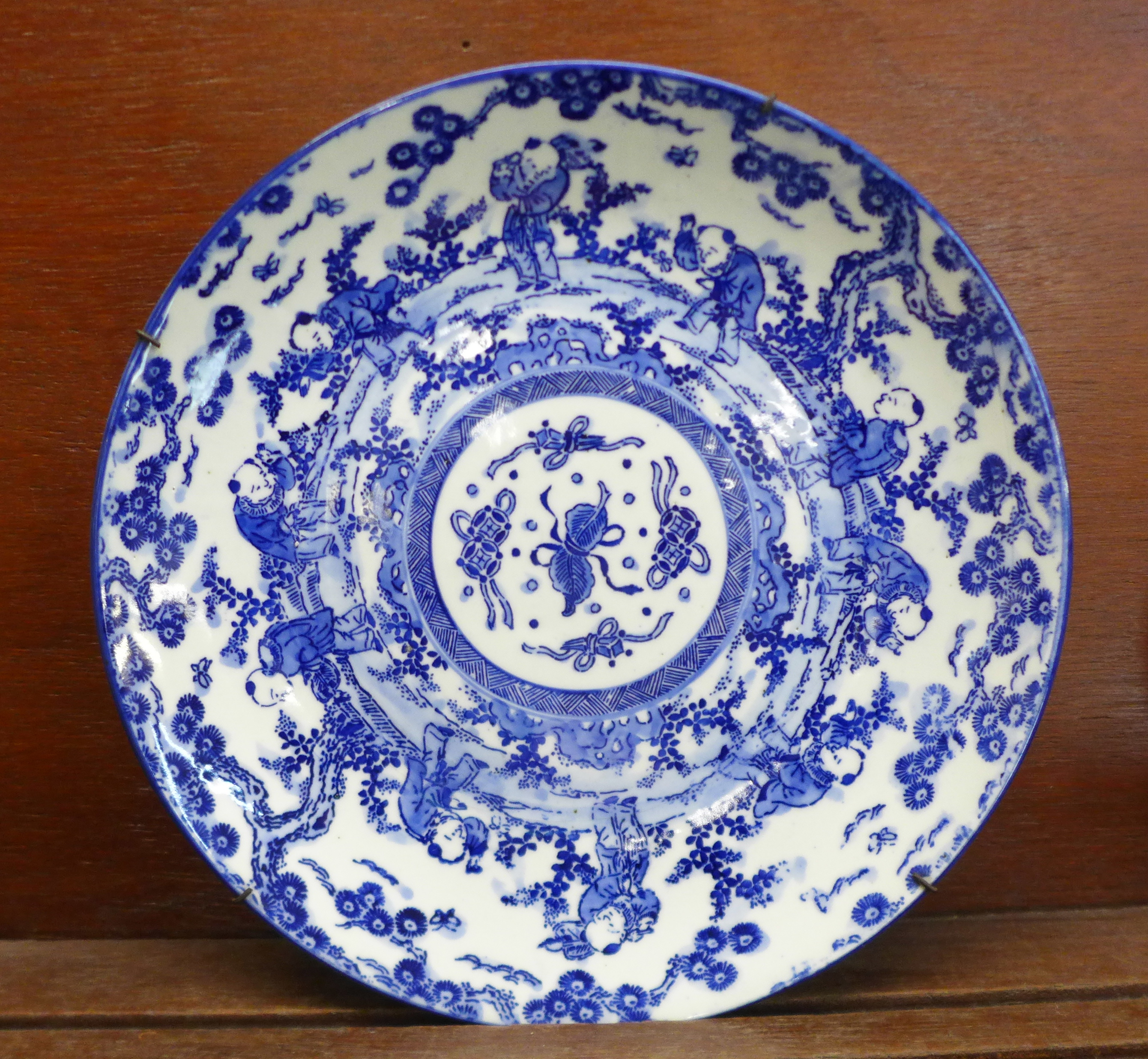 An oriental blue and white charger, impressed mark, 30cm