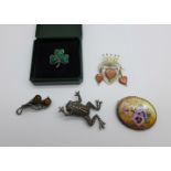 Four silver brooches and a frog brooch