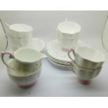A six setting Bell china tea service, six cups, saucers, side plates, sugar and cream
