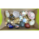 A collection of fourteen decorative eggs