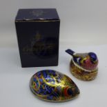 Two Royal Crown Derby paperweights, small chip to the tail of Bullfinch Nesting