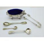 A George IV silver mustard spoon, two other spoons, a pair of silver sugar bows and a novelty pig