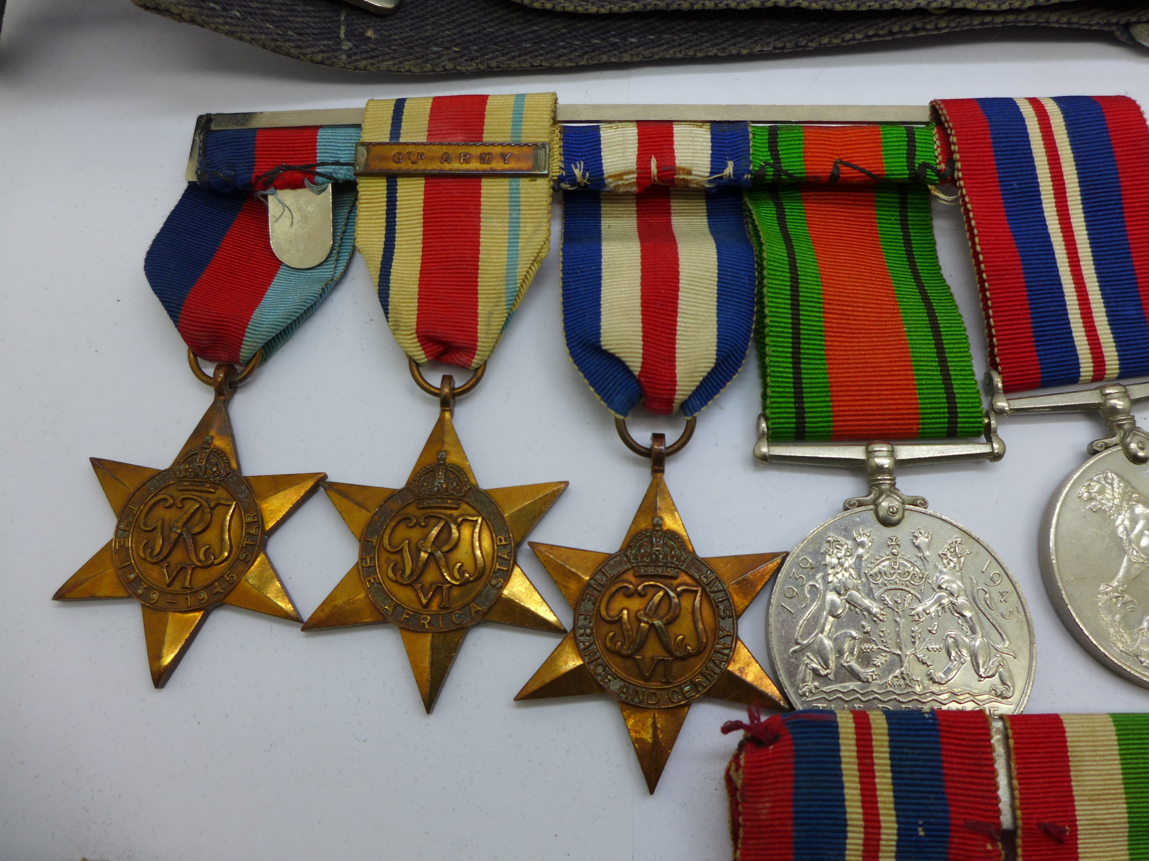 A collection of WWII medals including one group with 1st Army clasp, a silver Fearnaught badge and a - Bild 4 aus 5