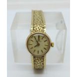 A lady's 9ct gold Omega wristwatch, 18.3g with movement