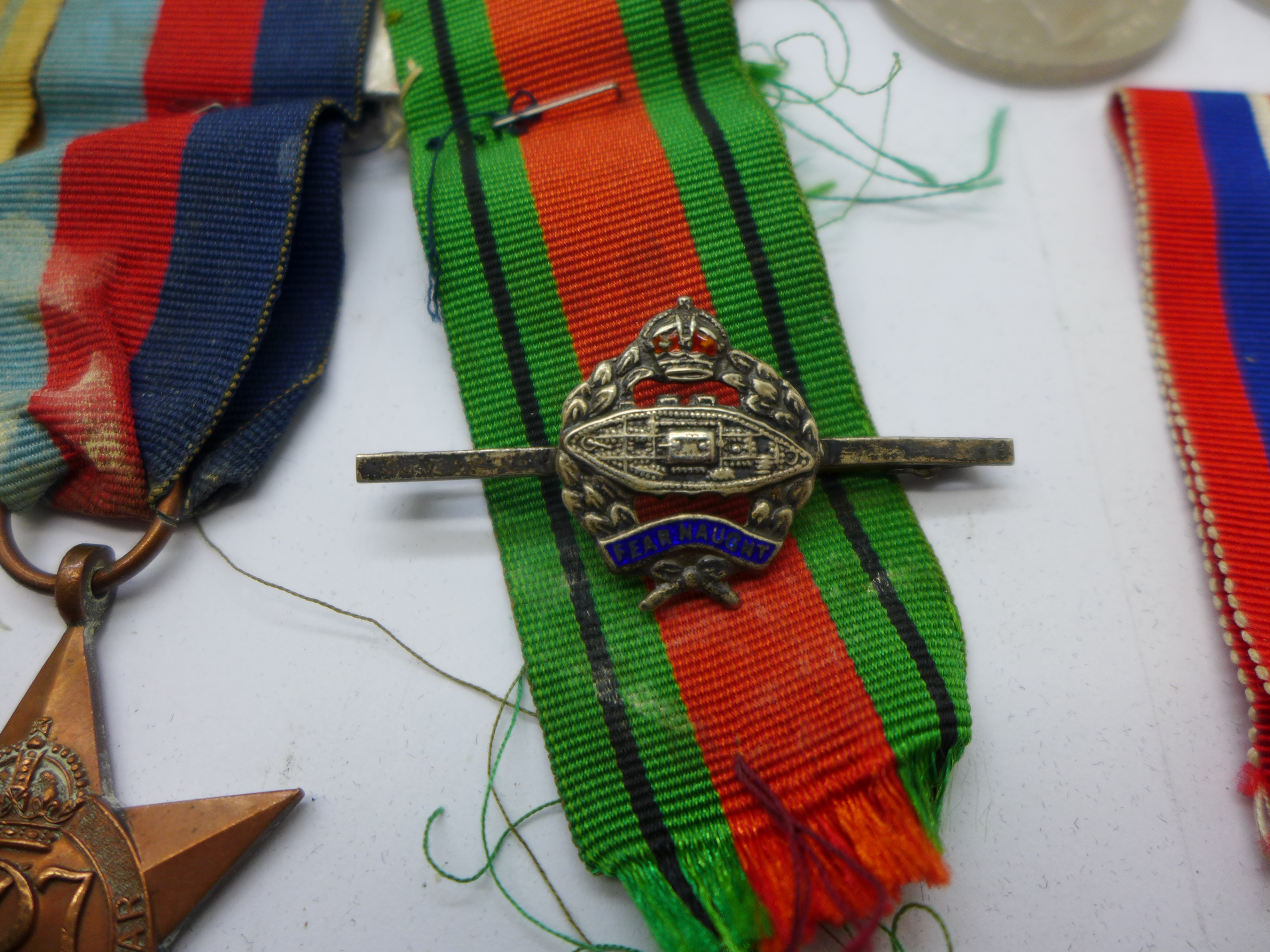 A collection of WWII medals including one group with 1st Army clasp, a silver Fearnaught badge and a - Bild 2 aus 5