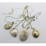 Four silver lockets and chains