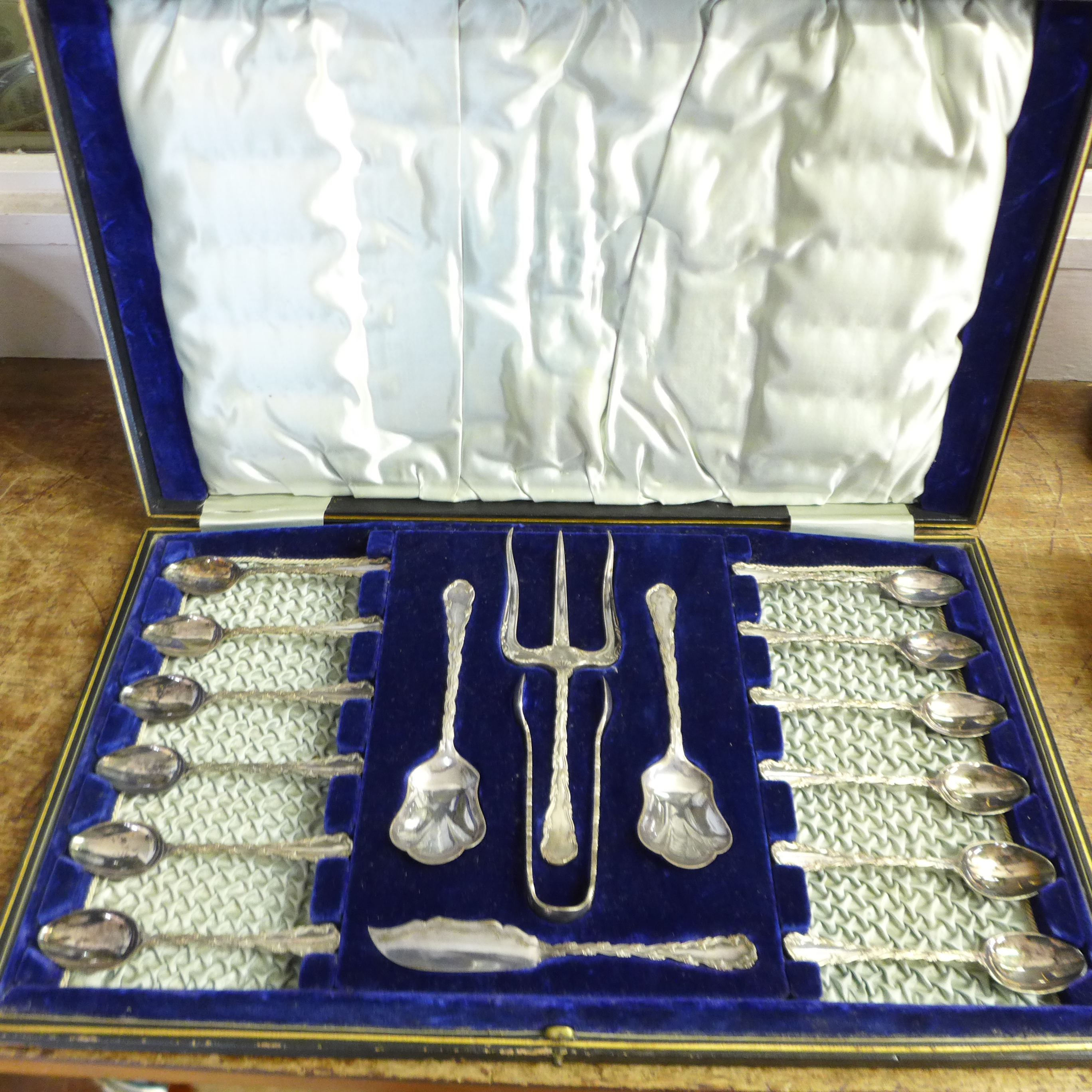 A plated spoon and server set
