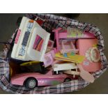 A collection of Barbie and Sindy cars and accessories