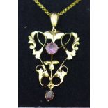 A 9ct gold and amethyst set Art Nouveau pendant and chain, 3.3g