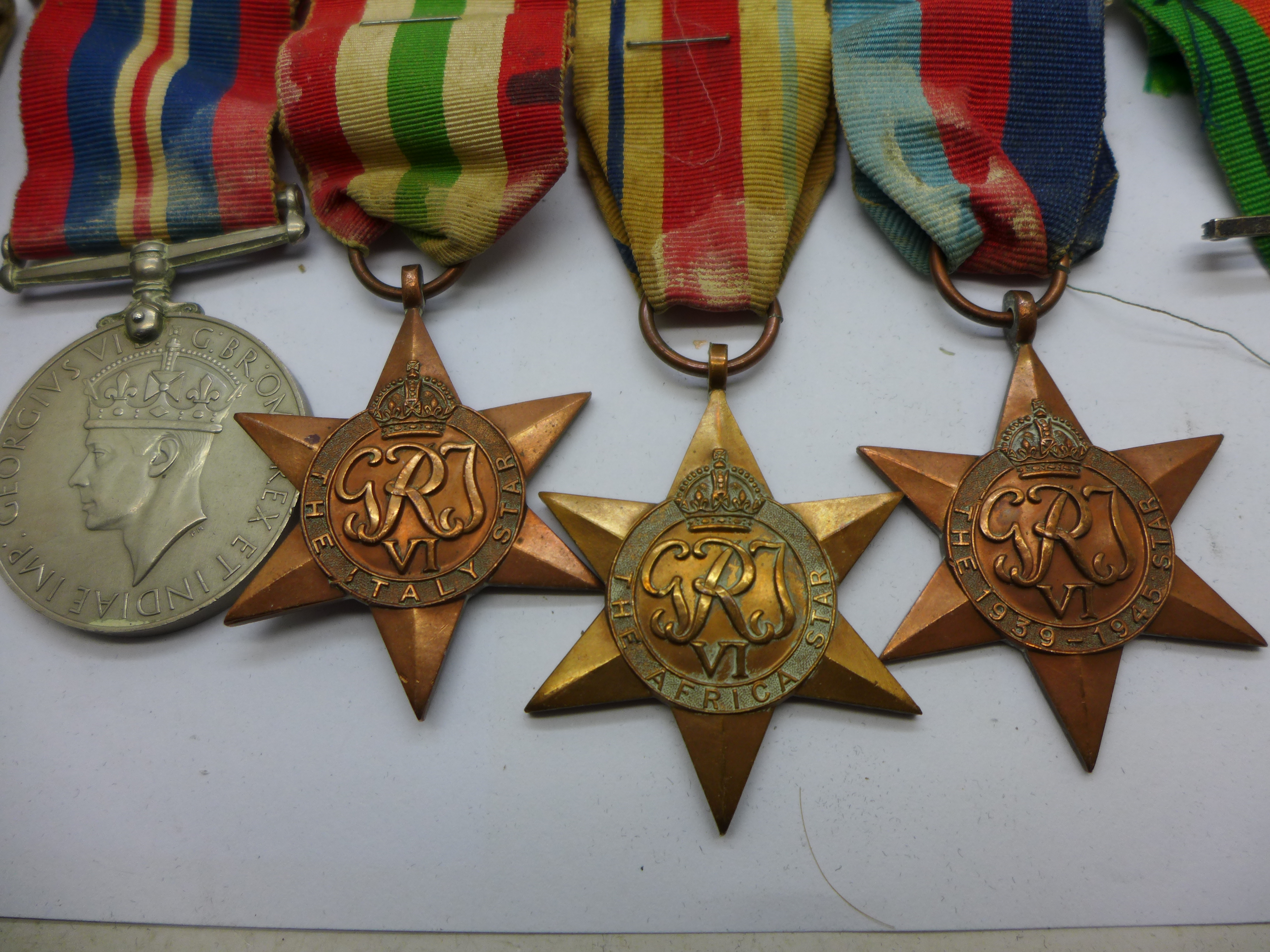 A collection of WWII medals including one group with 1st Army clasp, a silver Fearnaught badge and a - Bild 3 aus 5