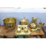 A collection of brass, a tea caddy, heavy jug, jardiniere, double ink stand, coat hook and novelty