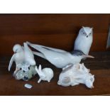 A Royal Copenhagen owl, rabbit, pigs, tern and doves, (owl, pigs, tern and doves a/f)