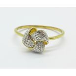 A silver gilt knot ring with diamond accent, T