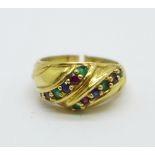 A yellow metal ring set with sapphire, ruby and emerald, shank a/f