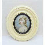 A Georgian portrait miniature in an oval ivory frame, miniature 5.5cm wide, frame a/f