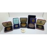 A collection of medals including The Grand Theatre Wolverhampton and other medallions
