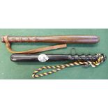 A wooden truncheon and one other truncheon with applied Hong Kong Police badge