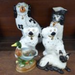 A pair of Beswick Staffordshire Spaniels, a Royal Doulton Siamese cat, a Markay Art pottery duck, an