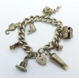 A silver charm bracelet with Victorian silver whistle, 50g, whistle dented