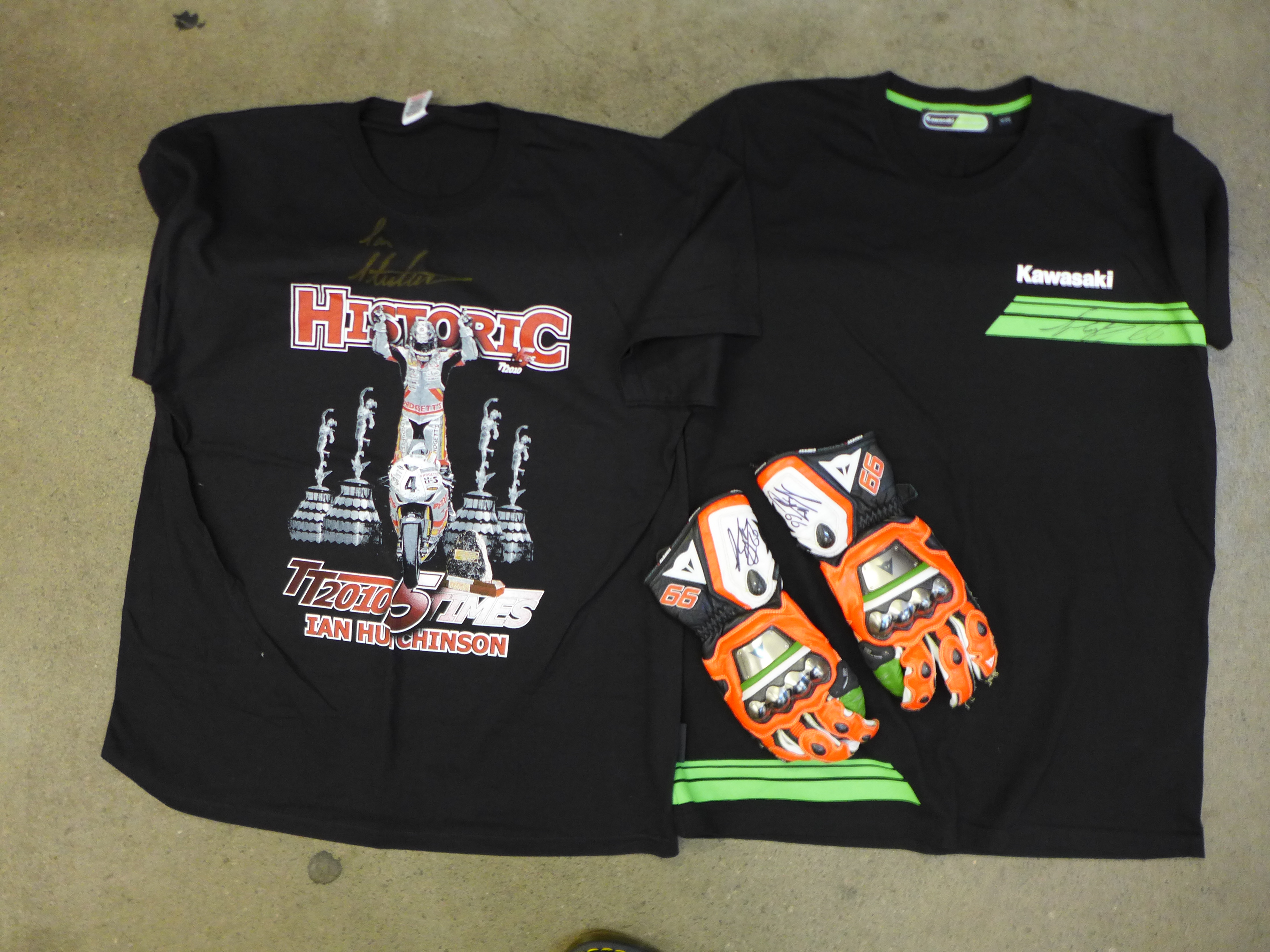 A pair of motorcycle gloves and a Kawasaki T-shirt, both signed by Tom Sykes and a signed Ian