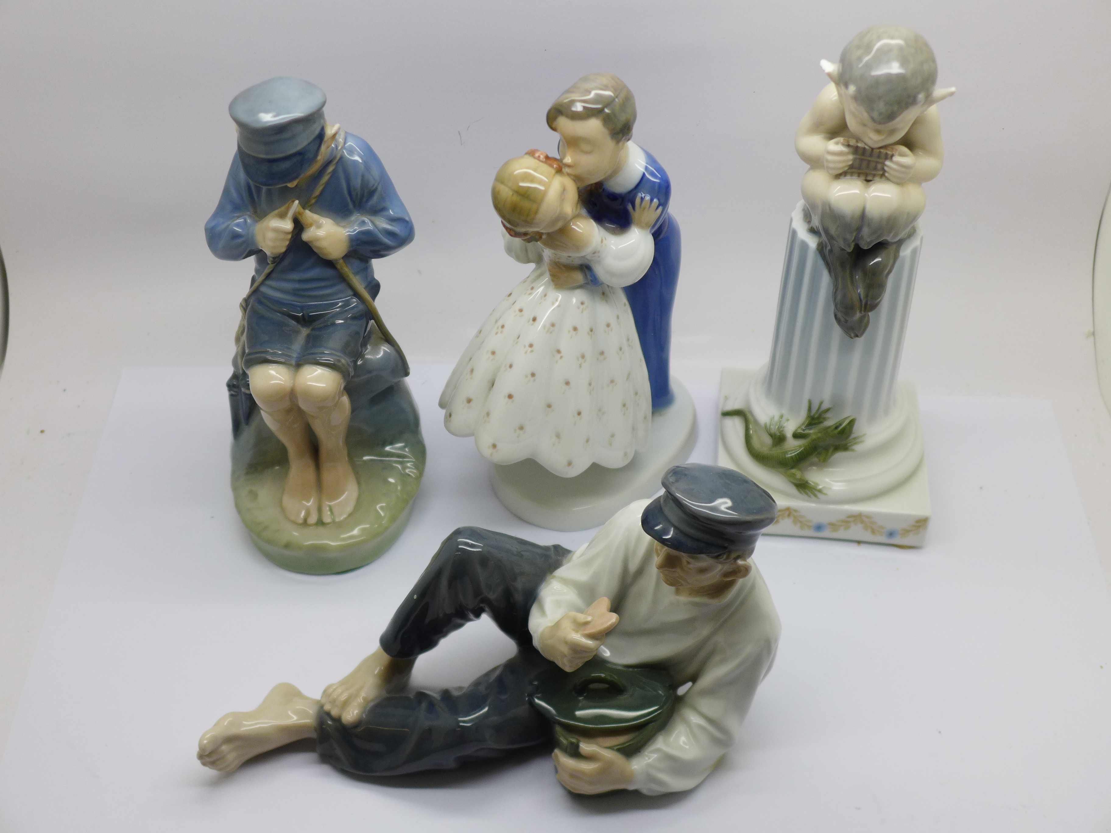 Two Royal Copenhagen figures of Dutch boys, a figure of a pixie (ear a/f) and a B&G figure of a