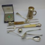 A collection of plated items including a silver mounted fork, one other fork, a measure and two