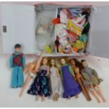 A collection of dolls and clothing in a Pippa case, some a/f