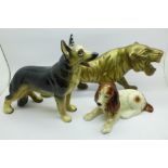 A brass model tiger and two model dogs
