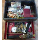 A vintage jewellery box with contents including pocket watch, cut steel buckles, medallions, etc.