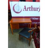 A Danish teak desk and chair