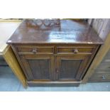 A Victorian mahogany and pine two door cupboard