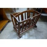 A mahogany magazine rack