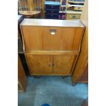 A teak bureau and a Nathan teak corner cabinet