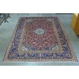 A Persian hand made blue ground rug, 345 x 240cms