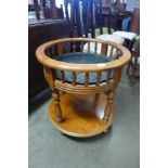 A beech two tier circular etagere