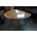 An Ercol Golden Dawn elm and beech drop leaf table