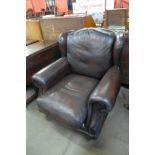 A Thomas Lloyd chestnut brown leather armchair