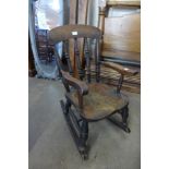 A Victorian child's elm and beech rocking chair