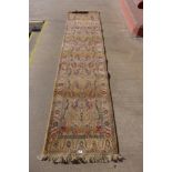 A mustard ground runner rug, 281 x 70cms