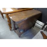 A George II oak single drawer gateleg table